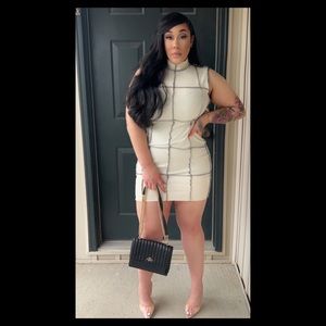 This sheik sleeveless daytime dress is one for the books!